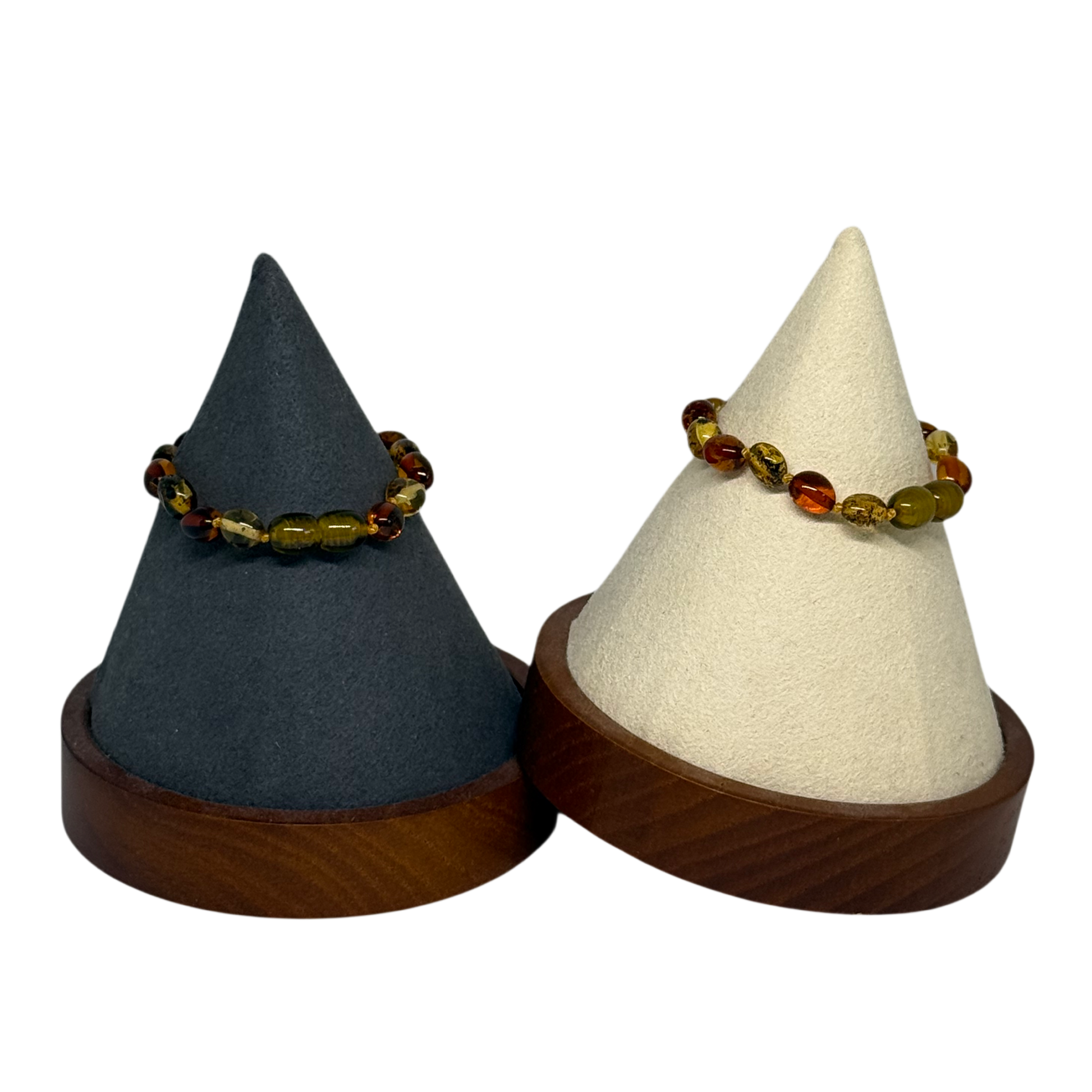 Two cone-shaped jewelry stands with a bracelet on a white background